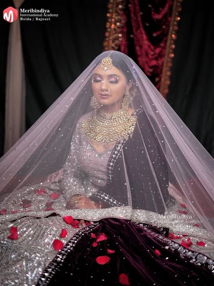 Learn how to ensure makeup looks perfect from every angle and even under a veil. This shot highlights the durability and finish of a professionally done bridal look.