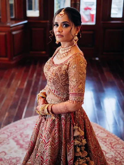 A full-length portrait of my bride in her stunning Rimple and Harpreet lehenga. The makeup was designed to complement the grandeur of the outfit, with a focus on a regal and poised finish for her destination wedding.