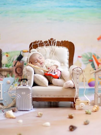 The ultimate newborn beach party. This wide shot showcases the entire vibrant and playful setup we can create for a memorable beach-themed session.