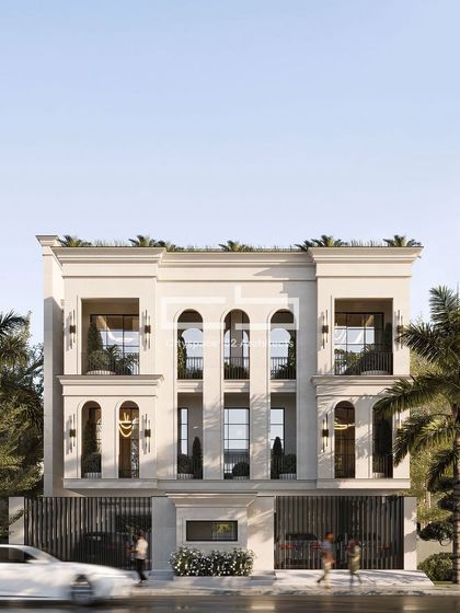 This facade exemplifies a refined synthesis of classical architectural elements and modern sensibilities. The vertical rhythm is emphasized through a series of arched fenestrations and slender pilasters, lending a sense of proportion and elegance.