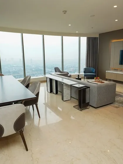 This photograph showcases the entire open-plan living and dining area from a comprehensive angle. It’s designed to give real estate clients and potential buyers a clear understanding of the space's flow and generous proportions.