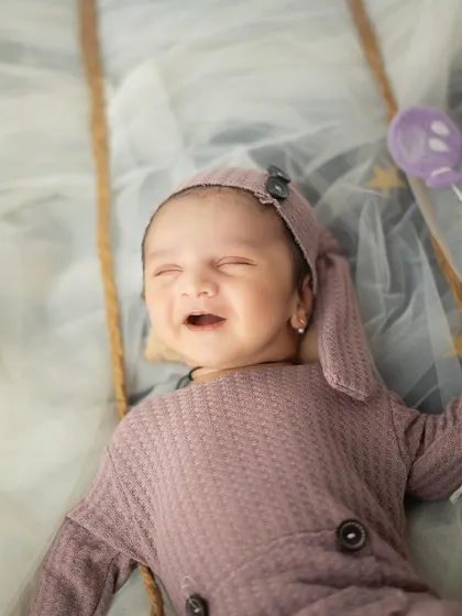A sleepy little smile that melts my heart. These are the magical, unscripted moments I look for during every newborn session.
