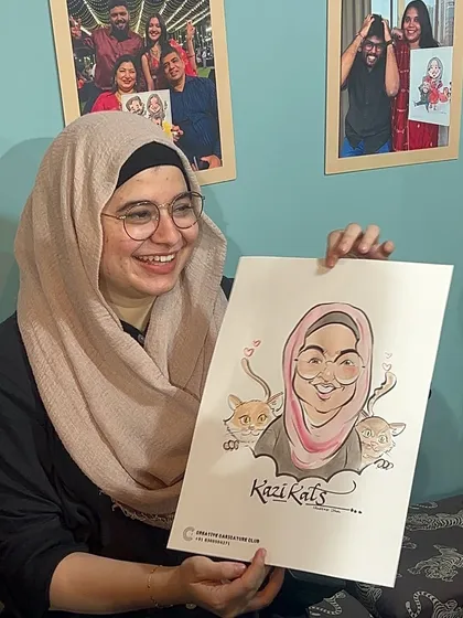 This guest was so happy with her portrait, which included her beloved cats. I love adding these personal details that make each drawing extra special.