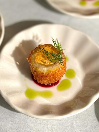 Another view of our bite-sized goat cheese appetizer, a perfect example of how we pack complex flavours into a single, delightful mouthful.