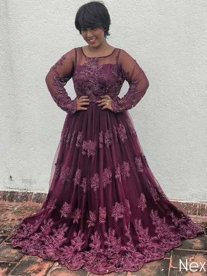A powerful and confident stance in this elegant gown. Your host's appearance sets the tone for the event.