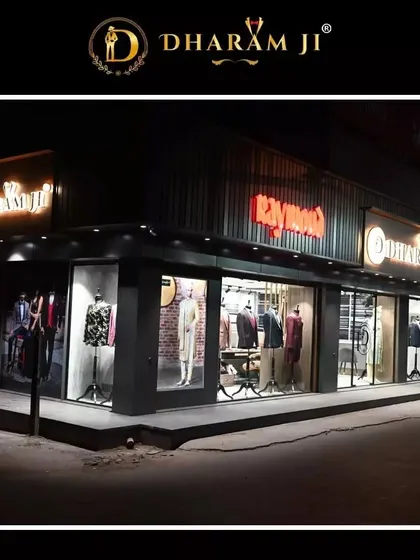An angled view of our corner showroom at night. The large windows give you a peek at the latest styles and collections on display.