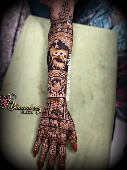 A full arm bridal design that is rich with symbolism. It features a cow with its calf, representing love and nurturing, alongside portraits and other traditional wedding motifs.