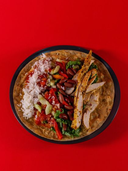 A top-down view of the Chicken Burrito Wrap before it's rolled. It's a balanced and flavorful combination that's perfect for a healthy lunch or dinner.