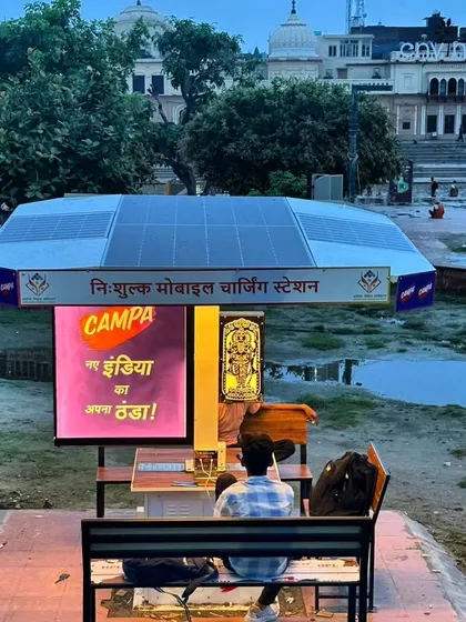 A view of our solar charging station at Ram ki Paidi, with the historic ghats of Ayodhya in the background. Our installations are designed to complement their surroundings while providing modern conveniences.