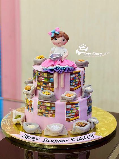 A very unique cake for someone who owns a grocery store. This two-tier cake is decorated with edible prints of store shelves and tiny fondant sacks of grains and pulses.