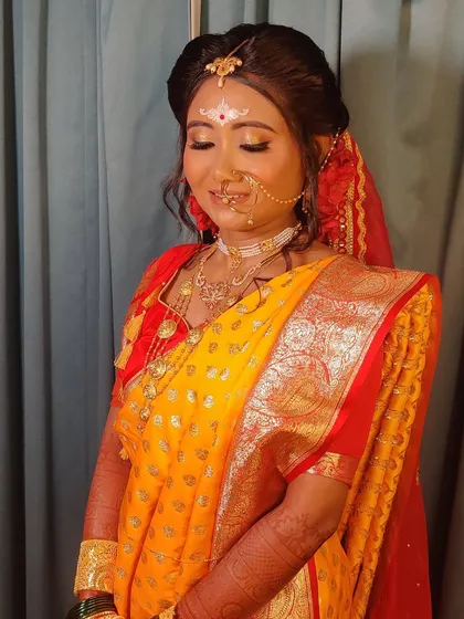The complete look, from the perfectly draped saree to the radiant makeup.