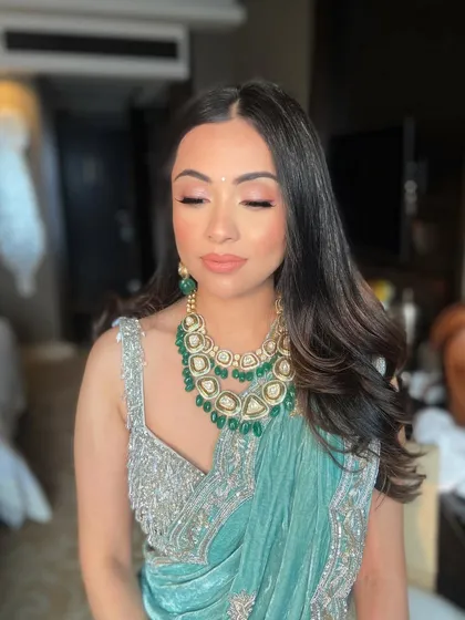 A serene shot of Sanam, with her eyes closed to showcase the soft, neutral eyeshadow.