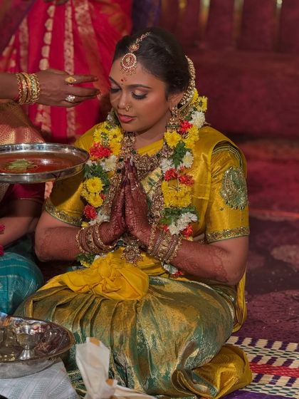Prithivi during the wedding rituals. This photo shows the longevity of the makeup and how it enhances her beauty without looking artificial, even after hours of wear.