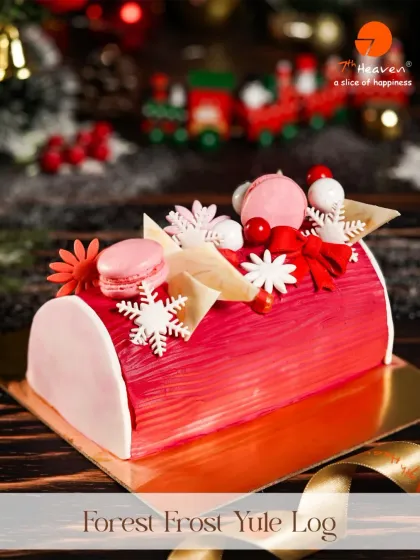 A beautiful Forest Frost Yule Log, decorated with macarons and edible snowflakes. This red log cake is a modern and elegant centerpiece for any Christmas celebration.