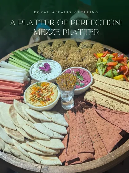 This is my take on a perfect Mezze Platter. It includes creamy hummus and beetroot dip, fresh falafel, crisp vegetable sticks, and a variety of pita and lavash, offering a healthy and flavorful option for your guests.