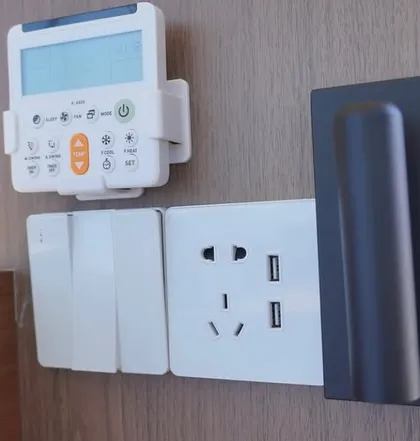 Smart home technology is integrated into our designs. This panel shows the climate control, power outlets, and USB charging ports conveniently located by the bedside.