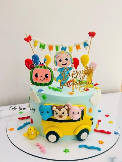 A Cocomelon cake full of color and fun for a first birthday. The fondant bus and characters bring the nursery rhymes to life.