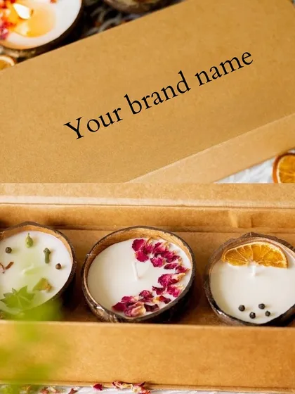 If you dream of starting your own candle brand, we can help. This is an example of our white-labeling service, where we create beautiful coconut shell candles and package them in custom boxes with your brand name.