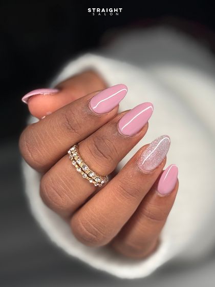 A close-up on the glitter accent nail, showing the beautiful blend of pink and white with a touch of shimmer.