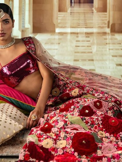 A majestic palace corridor, created with projection. The long, repeating architectural lines create a sense of depth and grandeur, perfectly framing the traditional Indian attire.