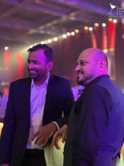 Our founders, Sid and Ovais, sharing a moment behind the bar. Their leadership and passion for mixology are the foundation of our company's commitment to excellence.