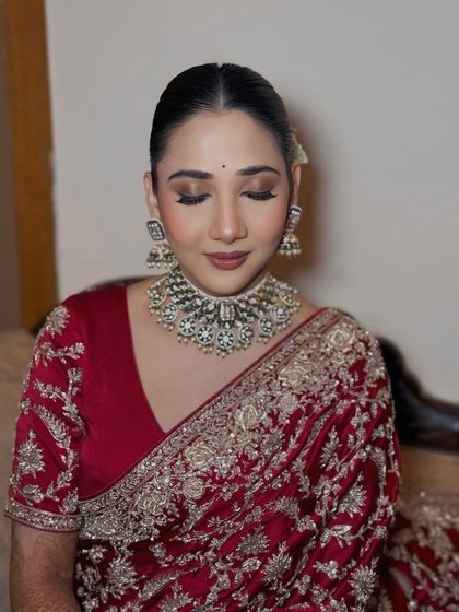 Wrapped in tradition, draped in elegance. A close-up of the soft glam makeup for this beautiful red saree look.