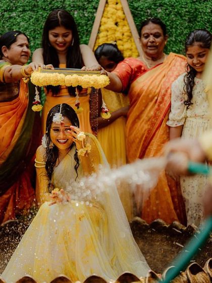 A playful moment from the Haldi ceremony. We love creating setups that allow for fun and memorable interactions between the bride and her family.