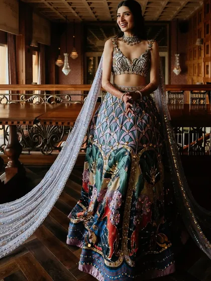 For this Sangeet, we went for a modern and artistic look. The bride's unique lehenga is the star, complemented by my clean makeup approach with a defined eye and a soft, neutral lip color.