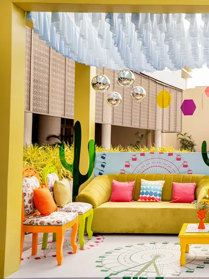 We brought festival vibes to this Haldi with a vibrant Coachella theme. The poolside lounge features a bold color palette, a custom-printed floor, cactus cutouts, and eclectic furniture, creating a fun, bohemian atmosphere for guests to relax and celebrate.
