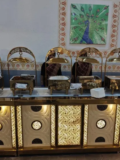 A full view of our ornate, gold-themed live station setup. We can customize the decor of our counters to perfectly match the theme of your wedding or celebration.