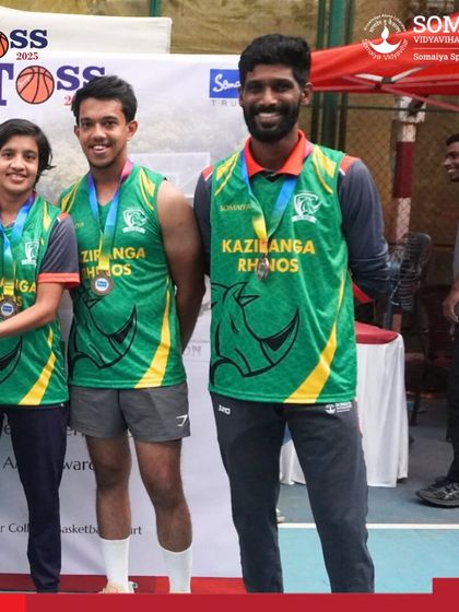 The Kaziranga Rhinos basketball team with their awards. We ensure that team branding is consistent across jerseys and event materials.