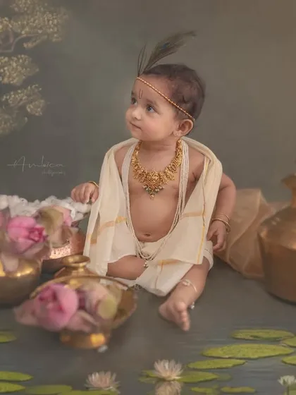 Here, I've created a serene riverbank scene with a hand-painted backdrop and floating water lilies. This little Krishna looks out thoughtfully, lost in his mythical world.