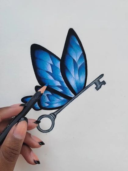 Me holding a pencil to the finished enchanted key drawing.