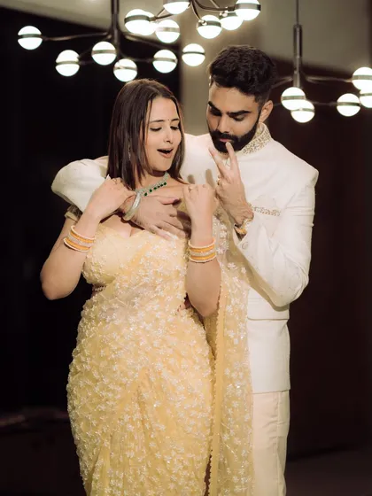 A fun, candid moment captured during an offbeat engagement shoot in Mumbai. The couple's playful interaction shows their personalities and the relaxed, soulful vibe of the session.