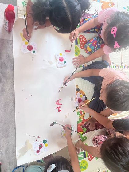 During our Holi celebration, the children worked together on a large canvas, painting and creating freely. This collaborative art activity is all about shared joy and expression.
