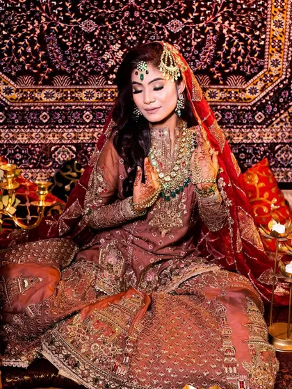 A beautifully composed shot of the Walima bride, capturing the grandeur and elegance of her entire look.