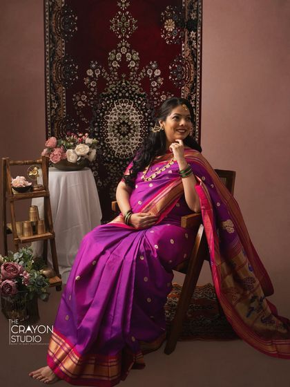 A joyful, candid style portrait of the mother to be. Her happy expression and comfortable pose make for a timeless and authentic memory.