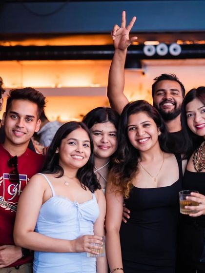 A group of friends having a blast and posing for a photo. The vibe is always positive and inclusive.