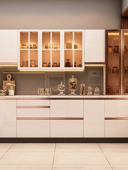 Our modular kitchens are where form meets function. This U-shaped kitchen design features high-gloss white cabinetry with rose gold accents, integrated glass display units, and a dedicated appliance tower, ensuring a seamless and elegant cooking experience.