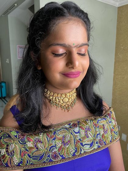 A close-up of Joshitha's makeup. The look is fresh, fun, and age-appropriate, perfect for a young family member at a celebration.