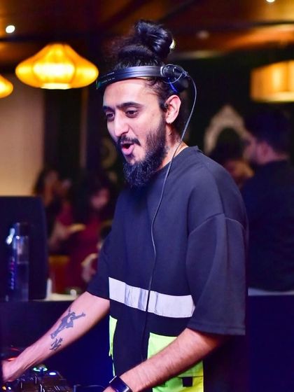 A candid shot of me in the middle of a mix, feeling the music. It's about being in the moment and letting the beats flow.