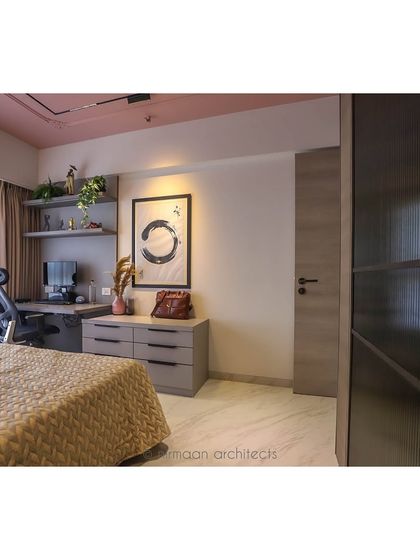 A view of the master bedroom from the doorway, showing the integrated desk and storage. The design is a perfect blend of modern classic style and practical functionality.