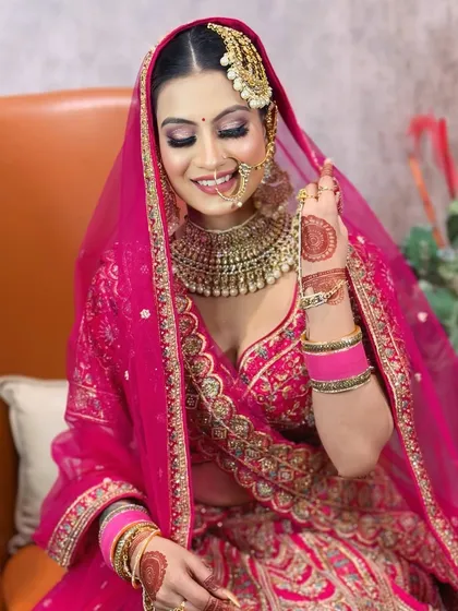 A beautiful, smiling portrait of the bride. Her makeup is fresh and radiant.