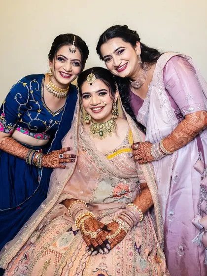 A beautiful family portrait with the bride looking absolutely radiant.