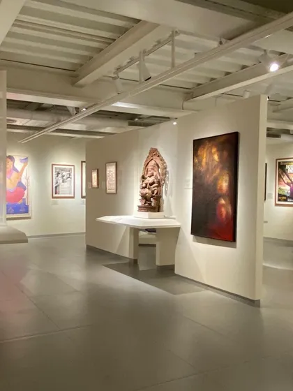 A long view through a gallery at the Museum of Art and Photography (MAP), showing how spaces flow into one another. The design encourages exploration and allows for multiple pathways through the museum's collection.