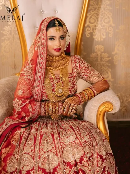 A bride's portrait is a timeless memory. I crafted this red lehenga to be the perfect frame for her beauty, with detailed embroidery that catches the light and heavy gold jewelry that completes the regal look.