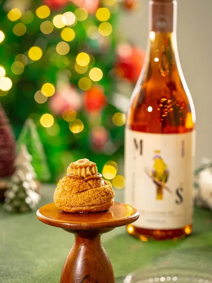 A similar shot of the Christmas pastry, showing a slightly different angle to highlight the texture and details of the dessert.