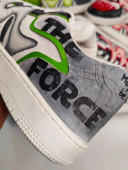 Detail of the heel on the Yoda sneaker, featuring the iconic phrase 'May the Force be with you'. Small, meaningful details are what make custom sneakers special.