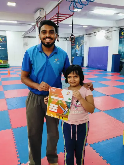 This student is happy to be recognized for her progress with a new certificate.