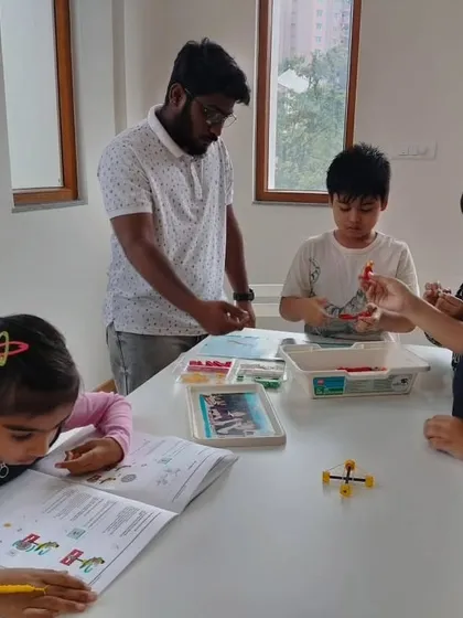 An instructor at our Whitefield center guides a group of students as they begin their journey with our LEGO Education weekend programs.